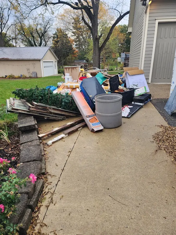 Dumpster being loaded with debris for Commercial Dumpster Rental in Redwood